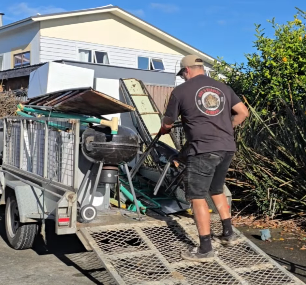 Roo’s Rubbish Removal loading unwanted items into a trailer