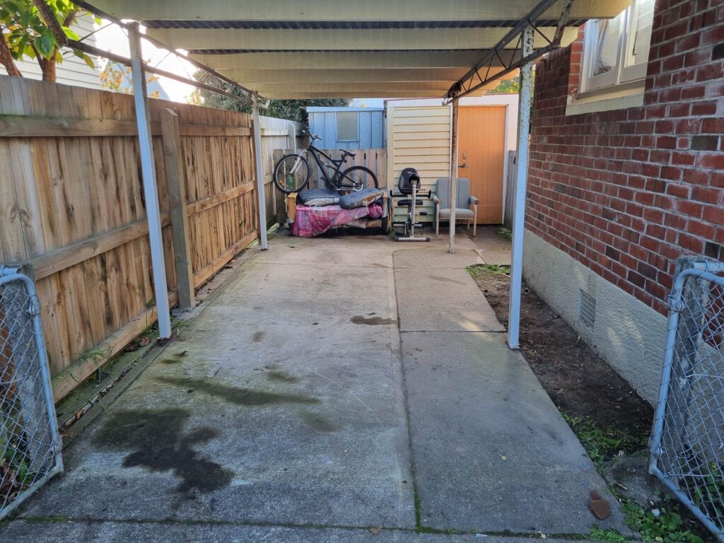 Carport area after a large quantity of household rubbish was removed in Palmerston North