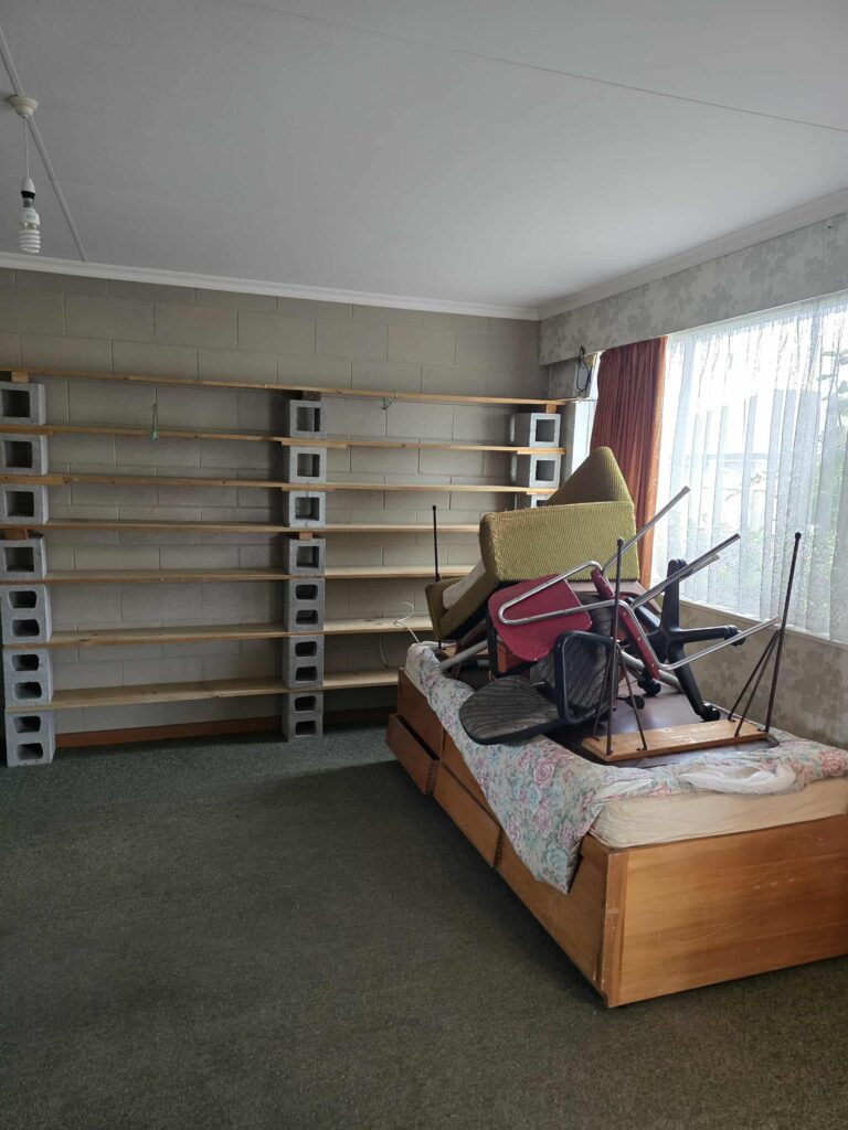 Furniture and unwanted items in a room before rubbish removal in Palmerston North