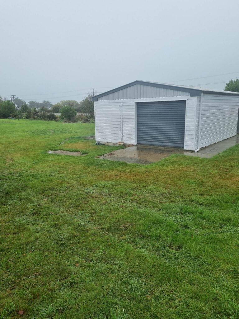 Cleared area outside a school building after rubbish removal in Newbury