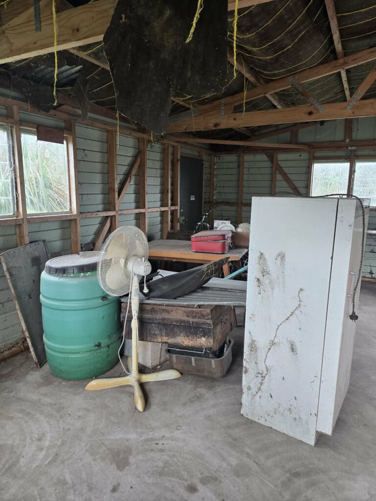 Shed containing unwanted items before rubbish removal in Tangimoana